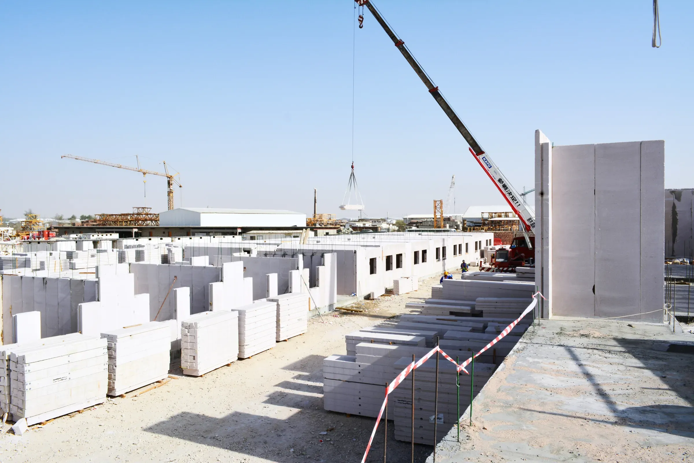 AAC panels on site at Barwa Argentine Village, crane behind