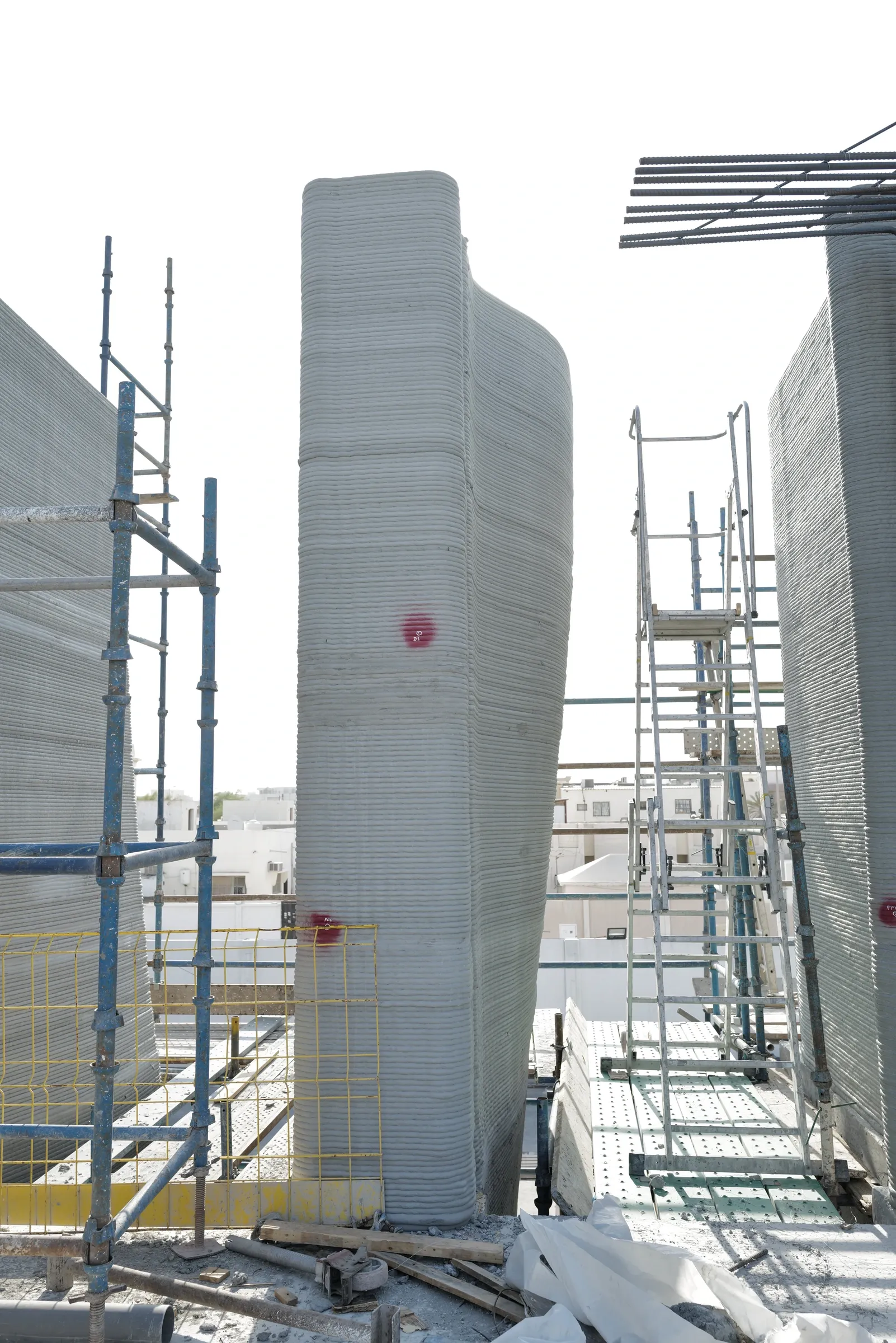 A tall printed column with a curved, leaning face at School 08
