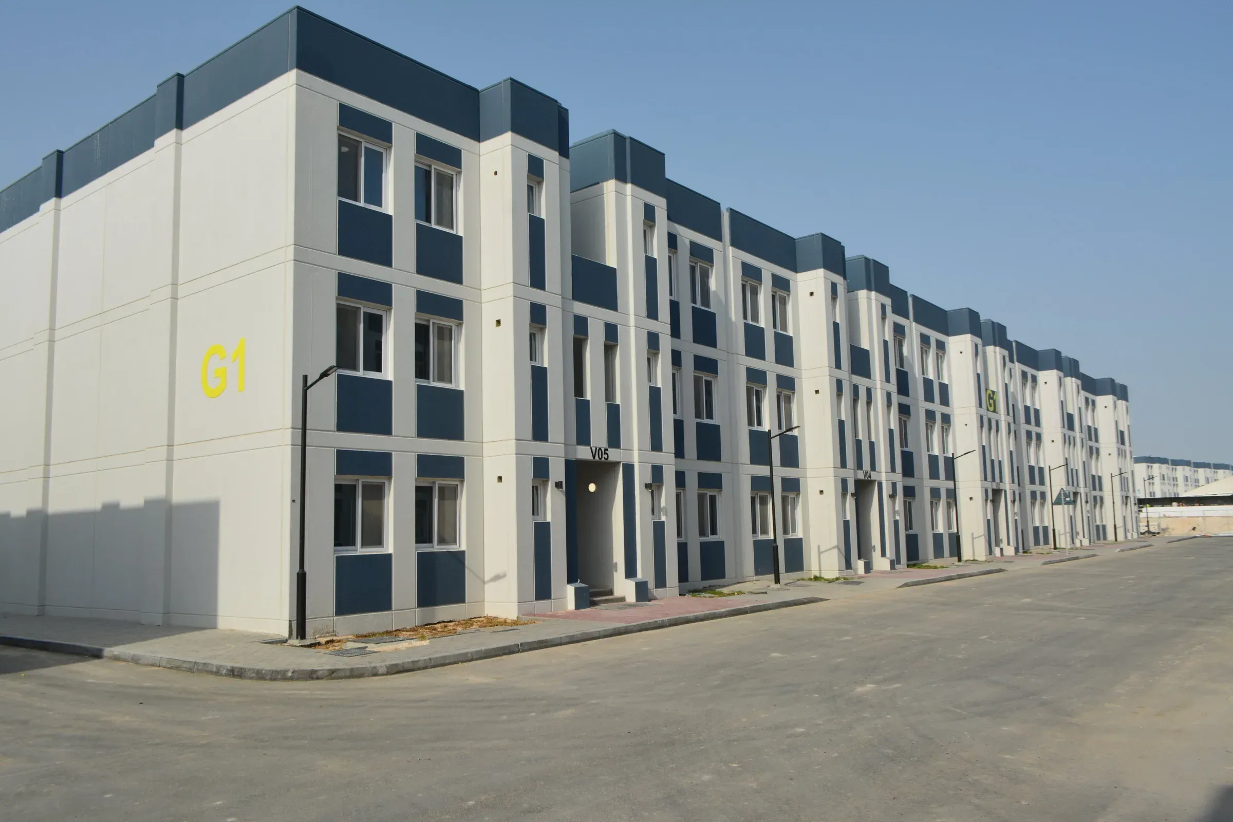 Street of G+2 accommodation blocks at Barwa Argentine Village